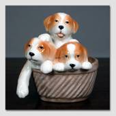 Welpen in einem Korb sehen süß aus, Royal Copenhagen Hund Figur