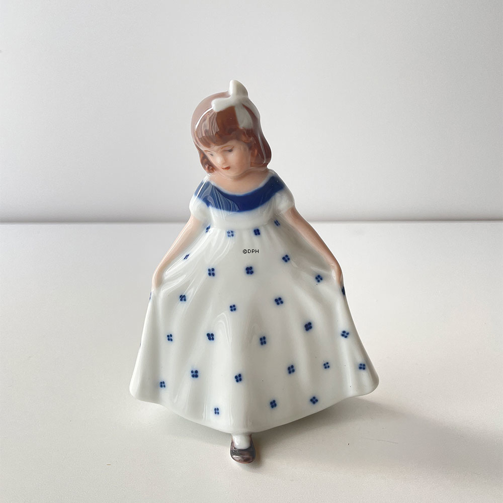 **Tysk:**  
Mini Tanzendes Mädchen mit weißem Kleid und blauen Punkten, Royal Copenhagen Figur Nr. 101