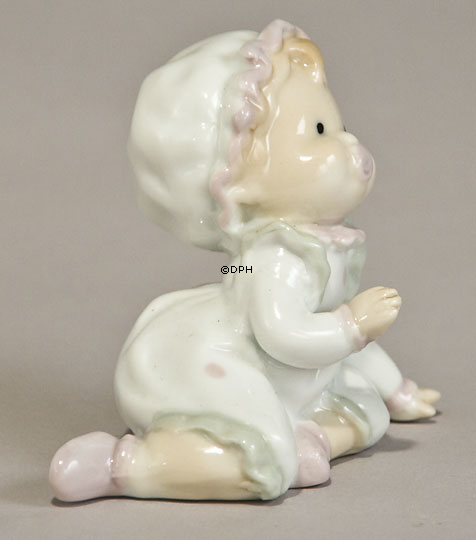 Baby mit Schnuller, der neugierig zuschaut - Was jetzt?