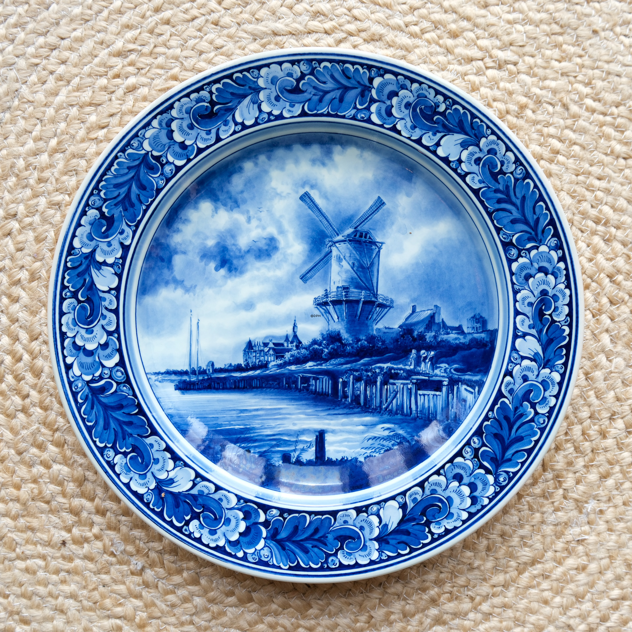 Teller mit Kanal und Mühle, holländischer Delft-Teller