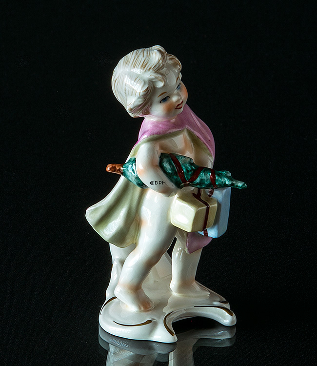 Goebel Hummel Monatsfigur Dezember Mädchen mit Weihnachtsbaum und Geschenken